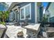 Outdoor living space with stone patio, chairs, and a convenient bar area at 1588 Paradise Lake Dr, Mount Pleasant, SC 29464