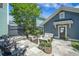 Inviting backyard oasis with stone patio, lounge seating, and privacy landscaping at 1588 Paradise Lake Dr, Mount Pleasant, SC 29464