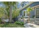 Relaxing backyard featuring a hot tub, egg chair, and manicured landscaping at 1588 Paradise Lake Dr, Mount Pleasant, SC 29464