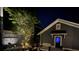 Inviting backyard with an outdoor seating area, privacy fence, and manicured greenery at dusk at 1588 Paradise Lake Dr, Mount Pleasant, SC 29464