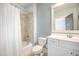 Bathroom with blue walls, shower/tub combo, white cabinets and tile flooring at 1588 Paradise Lake Dr, Mount Pleasant, SC 29464