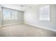 Bright and airy bedroom with neutral carpet and two large windows at 1588 Paradise Lake Dr, Mount Pleasant, SC 29464