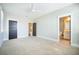 Spacious bedroom features neutral carpet, with an attached bathroom and multiple windows at 1588 Paradise Lake Dr, Mount Pleasant, SC 29464