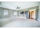 Bright bedroom features neutral carpet, ceiling fan, natural light, and open access to the ensuite at 1588 Paradise Lake Dr, Mount Pleasant, SC 29464