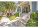 Inviting porch with stylish stairs and lush greenery, leading to a charming blue two-story home at 1588 Paradise Lake Dr, Mount Pleasant, SC 29464