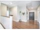 Hallway with hardwood flooring, white walls, and a decorative houseplant in a pot at 1588 Paradise Lake Dr, Mount Pleasant, SC 29464
