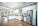 Spacious kitchen with an open layout, white cabinetry, and stainless steel appliances at 1588 Paradise Lake Dr, Mount Pleasant, SC 29464