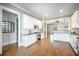 Open-concept kitchen with white cabinets, stainless steel appliances, and hardwood floors at 1588 Paradise Lake Dr, Mount Pleasant, SC 29464