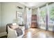 Charming living room filled with natural light, hardwood floors, and a comfortable chair at 1588 Paradise Lake Dr, Mount Pleasant, SC 29464