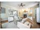 Cozy living room with fireplace, plush seating, and an open view to the kitchen at 1588 Paradise Lake Dr, Mount Pleasant, SC 29464