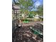 Charming playground area with swings, seesaws, and benches, set in a beautifully landscaped environment for Gathering fun at 1588 Paradise Lake Dr, Mount Pleasant, SC 29464