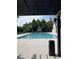 Relaxing pool area featuring clear blue water, comfortable lounge chairs, and shaded seating, perfect for leisure and enjoyment at 1588 Paradise Lake Dr, Mount Pleasant, SC 29464