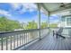 Covered porch with relaxing seating and beautiful views of the neighborhood at 1588 Paradise Lake Dr, Mount Pleasant, SC 29464