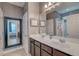 Bathroom with double sinks, large mirror, and shower-tub combo at 1589 Seabago Dr, Charleston, SC 29414