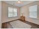 Bright, modern bedroom with wood floor and a decorative rug at 1589 Seabago Dr, Charleston, SC 29414