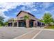 A daytime shot shows the brick exterior of a commercial building with outdoor seating and palm trees at 1589 Seabago Dr, Charleston, SC 29414