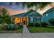 Charming home featuring manicured lawn, inviting front porch, and lush landscaping at 1589 Seabago Dr, Charleston, SC 29414