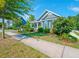 Charming single-Gathering home with lush landscaping, inviting curb appeal and a sunny blue sky at 1589 Seabago Dr, Charleston, SC 29414