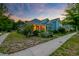 Charming two-story home featuring lush landscaping, and a well-maintained lawn at 1589 Seabago Dr, Charleston, SC 29414