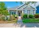 Charming home exterior with inviting front porch and lush landscaped yard at 1589 Seabago Dr, Charleston, SC 29414