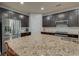 Featuring a gourmet kitchen with large granite island, stainless steel appliances, and ample cabinet space at 1589 Seabago Dr, Charleston, SC 29414