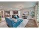 Open-concept living area connected to a modern kitchen with a large TV and ample seating at 1589 Seabago Dr, Charleston, SC 29414