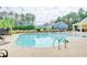 Community pool with lounge chairs, railing entry, and a scenic wooded backdrop at 1589 Seabago Dr, Charleston, SC 29414