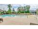 Community pool with shallow entry, chairs, and scenic trees and wooded background at 1589 Seabago Dr, Charleston, SC 29414