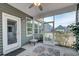 Enjoy this screened in porch with plenty of windows and a ceiling fan at 1589 Seabago Dr, Charleston, SC 29414