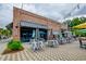 Restaurant exterior with outdoor seating area under string lights and umbrellas at 1589 Seabago Dr, Charleston, SC 29414