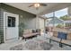 Relaxing screened porch featuring comfortable seating, ceiling fan, and a view of the outdoors at 1589 Seabago Dr, Charleston, SC 29414