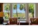 Relaxing backyard view with chairs by the window at 16 Fairway Village Ln, Isle of Palms, SC 29451