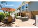 Backyard view with patio furniture, stairs to the upper level, and partially visible home exterior at 16 Fairway Village Ln, Isle of Palms, SC 29451