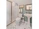 Bright bathroom features a glass shower, pedestal sink and decorative tile floors at 16 Fairway Village Ln, Isle of Palms, SC 29451