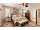 Bedroom featuring neutral paint colors, hardwood floors, and natural light at 16 Fairway Village Ln, Isle of Palms, SC 29451