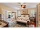 Bedroom with an ensuite office, hardwood floors, and neutral colors at 16 Fairway Village Ln, Isle of Palms, SC 29451