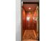 Interior view of a wood-paneled elevator with a patterned rug and brass accents at 16 Fairway Village Ln, Isle of Palms, SC 29451