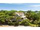 Exterior shot of the property showcasing lush landscaping and a well-maintained facade at 16 Fairway Village Ln, Isle of Palms, SC 29451