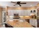Kitchen featuring granite countertops, updated stainless appliances, and white cabinetry at 16 Fairway Village Ln, Isle of Palms, SC 29451