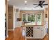 Gourmet kitchen with white cabinetry, hardwood floors, and granite countertops at 16 Fairway Village Ln, Isle of Palms, SC 29451