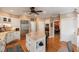 Kitchen with center island, stainless appliances, hardwood floors, and white cabinets at 16 Fairway Village Ln, Isle of Palms, SC 29451