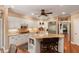 Open kitchen design with white cabinetry, hardwood floors, and stainless steel appliances at 16 Fairway Village Ln, Isle of Palms, SC 29451
