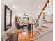 Inviting living area with a staircase and an open floor plan and scenic backyard views at 16 Fairway Village Ln, Isle of Palms, SC 29451