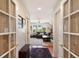 Hallway with french doors leading to a living room with a view of the outdoors at 16 Fairway Village Ln, Isle of Palms, SC 29451