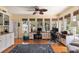 Bright and airy office features lots of windows, hardwood floors, and built-in shelving at 16 Fairway Village Ln, Isle of Palms, SC 29451