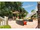 Outdoor patio featuring a seating area, dining table, and stairs leading to an upper level at 16 Fairway Village Ln, Isle of Palms, SC 29451