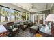 Bright and airy sun room with multiple seating options at 16 Fairway Village Ln, Isle of Palms, SC 29451