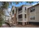 A view of the condo building with private screened balconies, wood facade, and classic architectural style at 1600 Long Grove Dr # 1512, Mount Pleasant, SC 29464