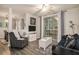 A well-decorated living room with modern furnishings and access to outdoor balcony at 1600 Long Grove Dr # 1512, Mount Pleasant, SC 29464