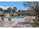 Community pool with seating, landscaping, and a clubhouse that enhances the community's appeal at 1600 Long Grove Dr # 1512, Mount Pleasant, SC 29464